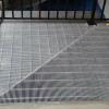 Mitered aluminum grate.